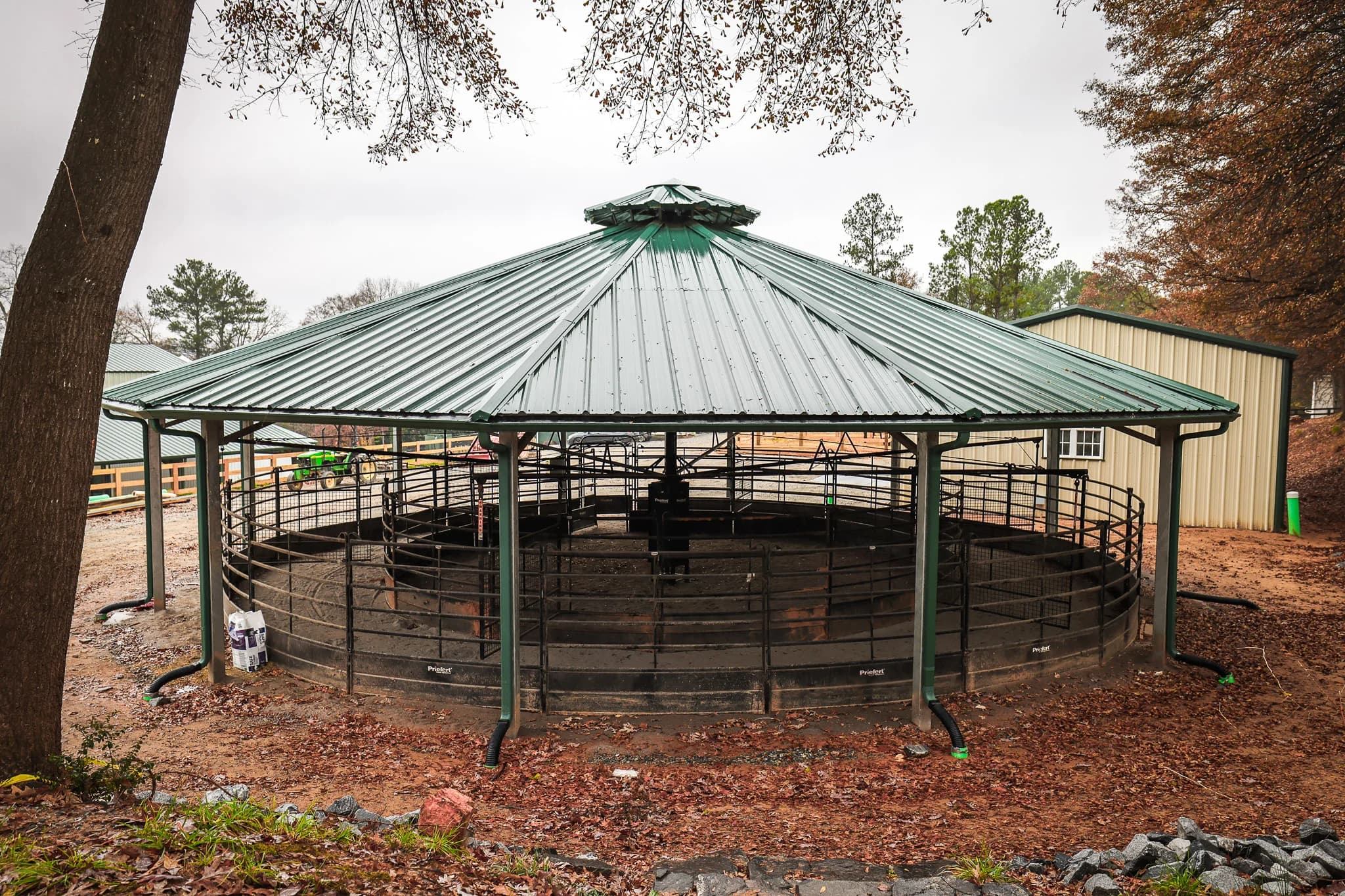 Covered round pen with steel roof for horse training