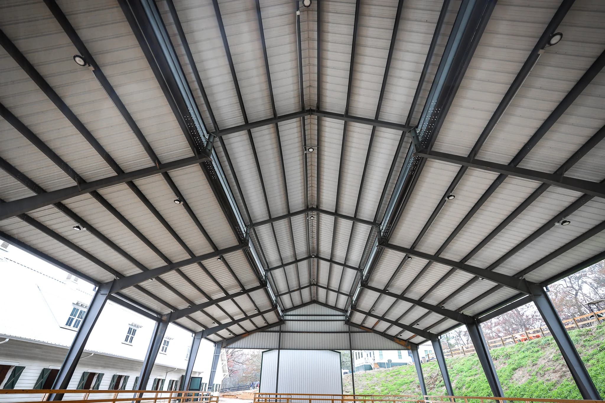 Steel arena interior ceiling showing frame and purlins