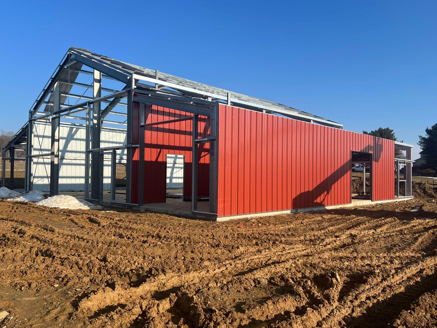Aerial view of a spacious steel barndominium showing the full building footprint