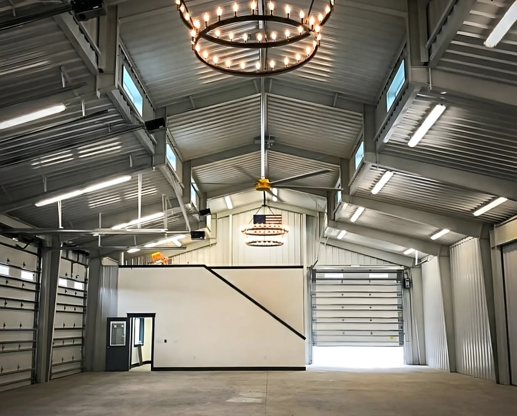 Interior transition between living space and workshop in a barndominium