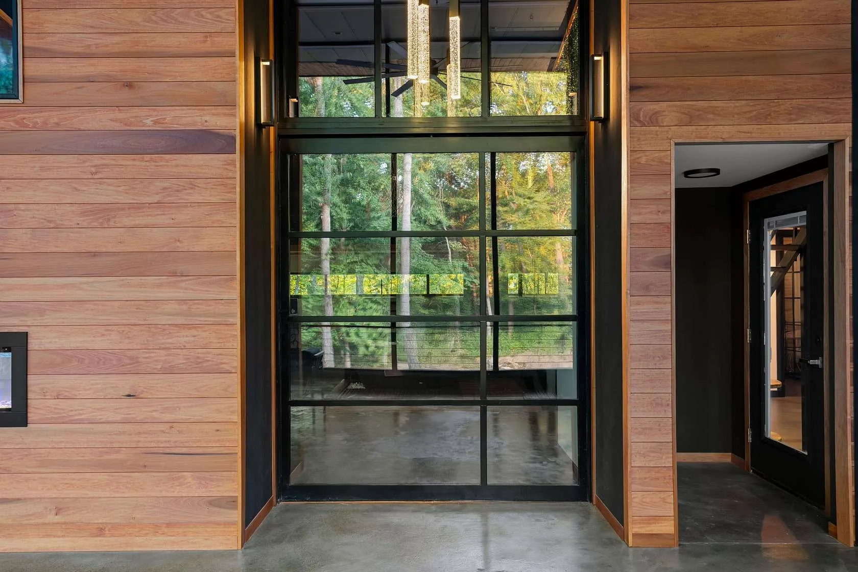 Hallway with wood-paneled accent walls