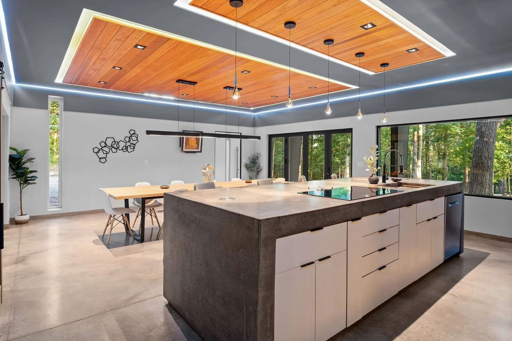 Kitchen island with bar seating and dining view
