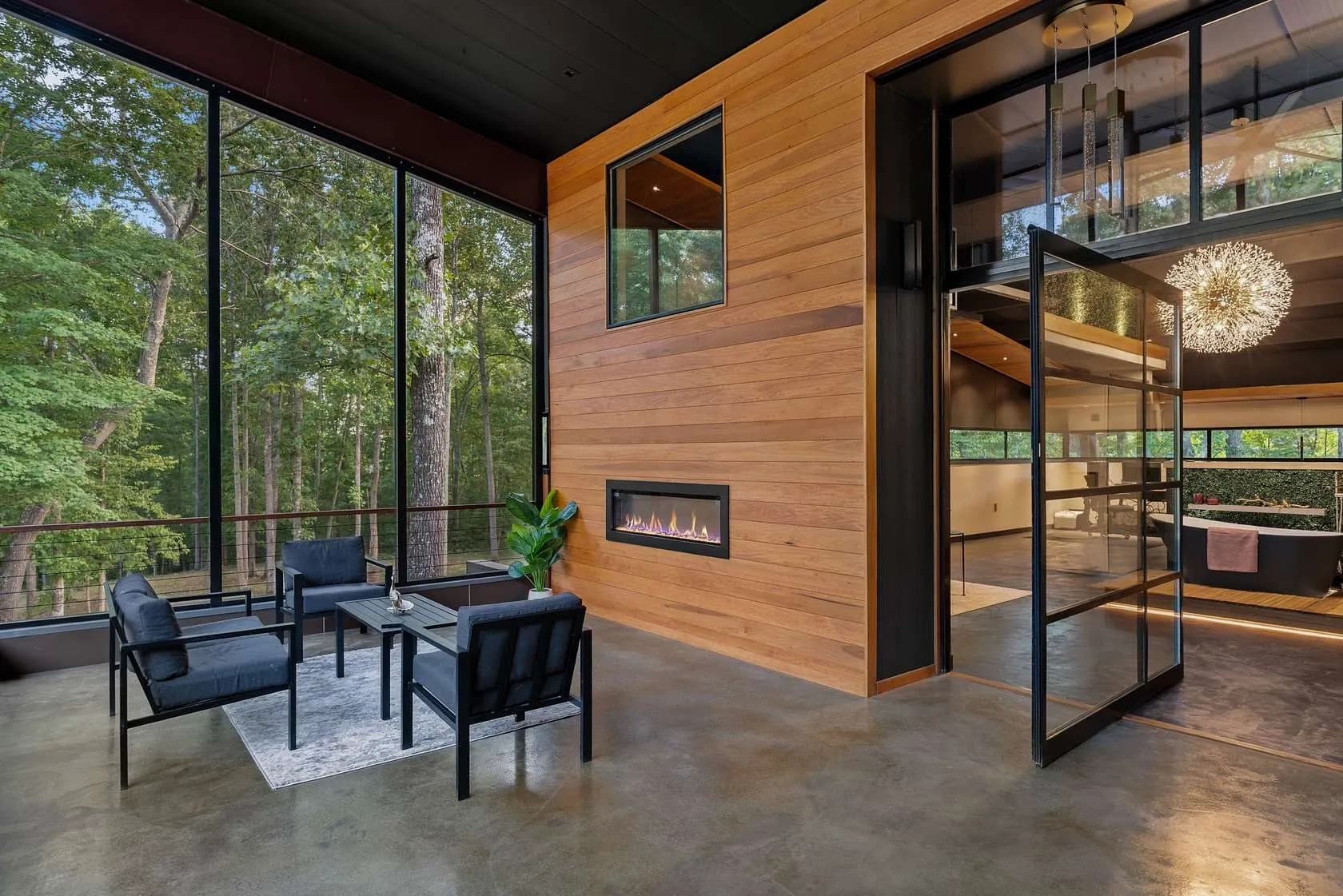 Screened porch evening view with fireplace glow